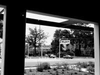 Little Rock Central High School, site of 1957 desegregation crisis.  The Mobil station has been preserved.  It was a gathering place for the crowd and had the only nearby pay telephone for reporters.  Photo taken inside National Historic Site visitor center; I made it black and white intentionally.  The high school building is quite impressive; it's still a school.